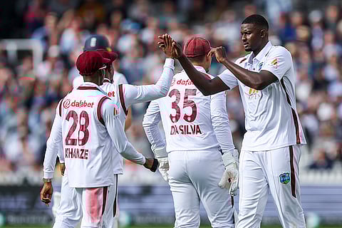 Jason Holder celebrates wicket of Ollie Pope